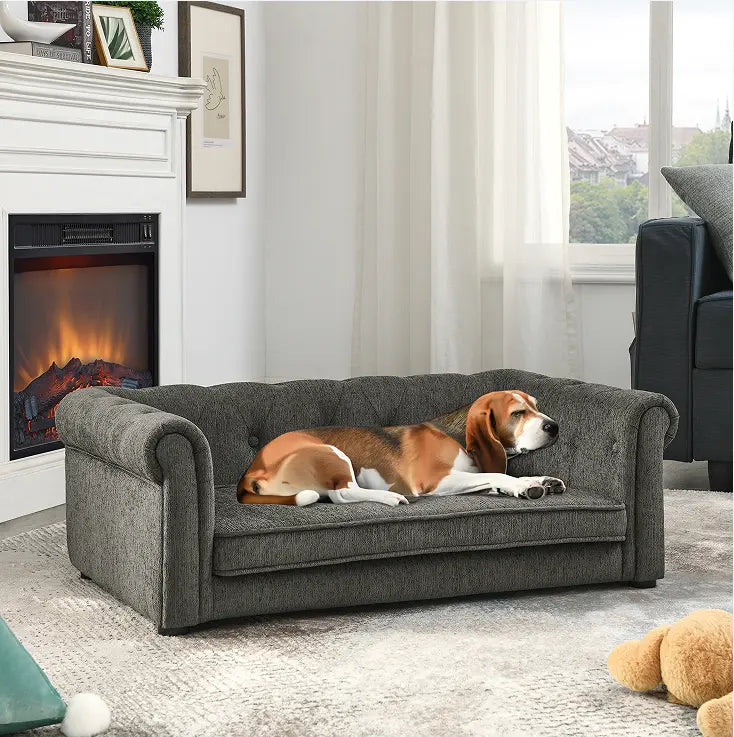 Beagle resting comfortably on a dark grey raised dog sofa